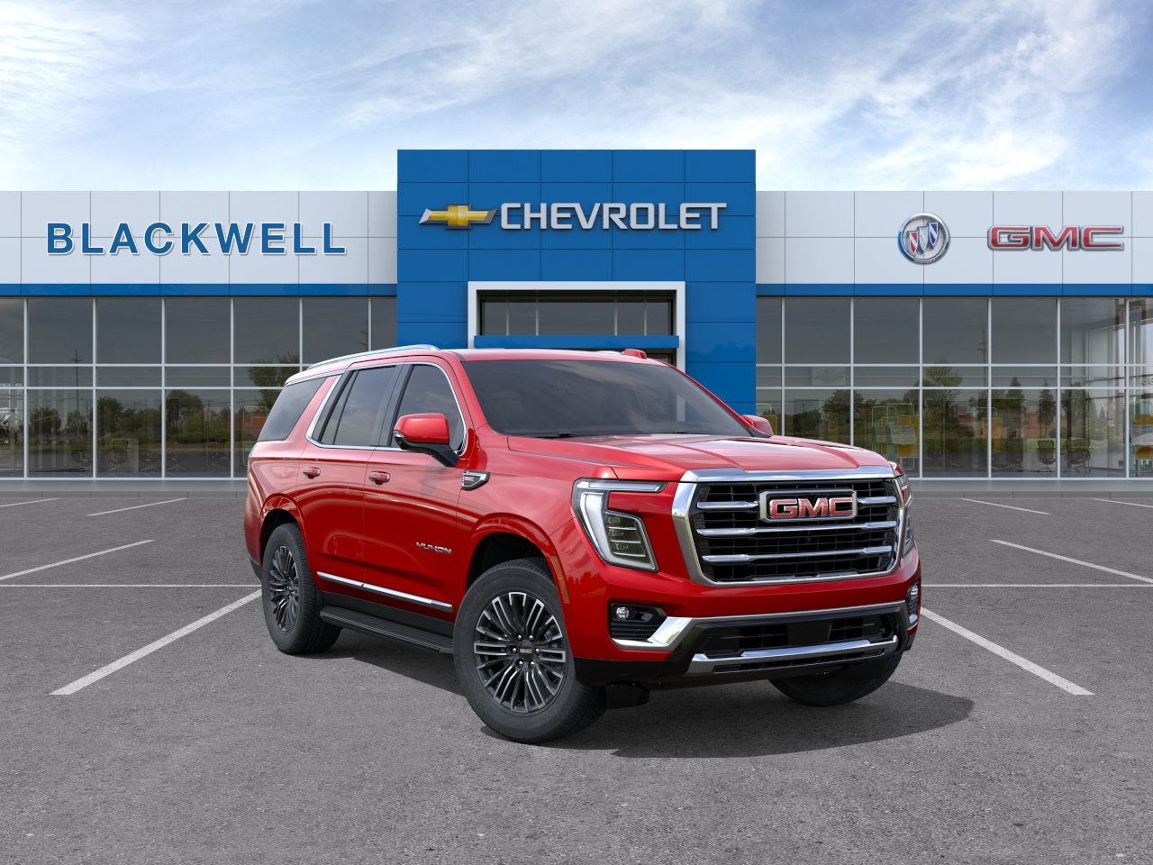 2026 GMC Yukon Elevation in Volcanic Red Tintcoat — front three-quarter view